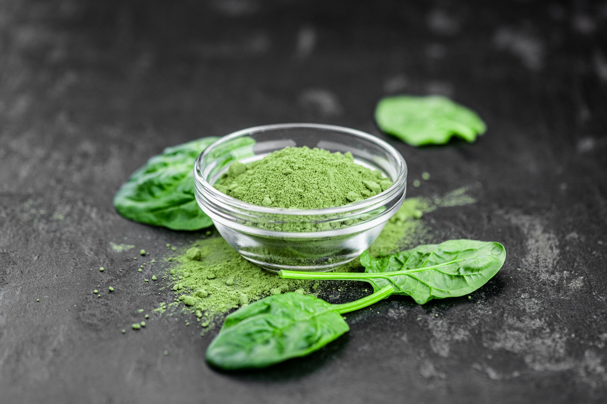 Homemade green spinach powder (close up shot; selective focus)