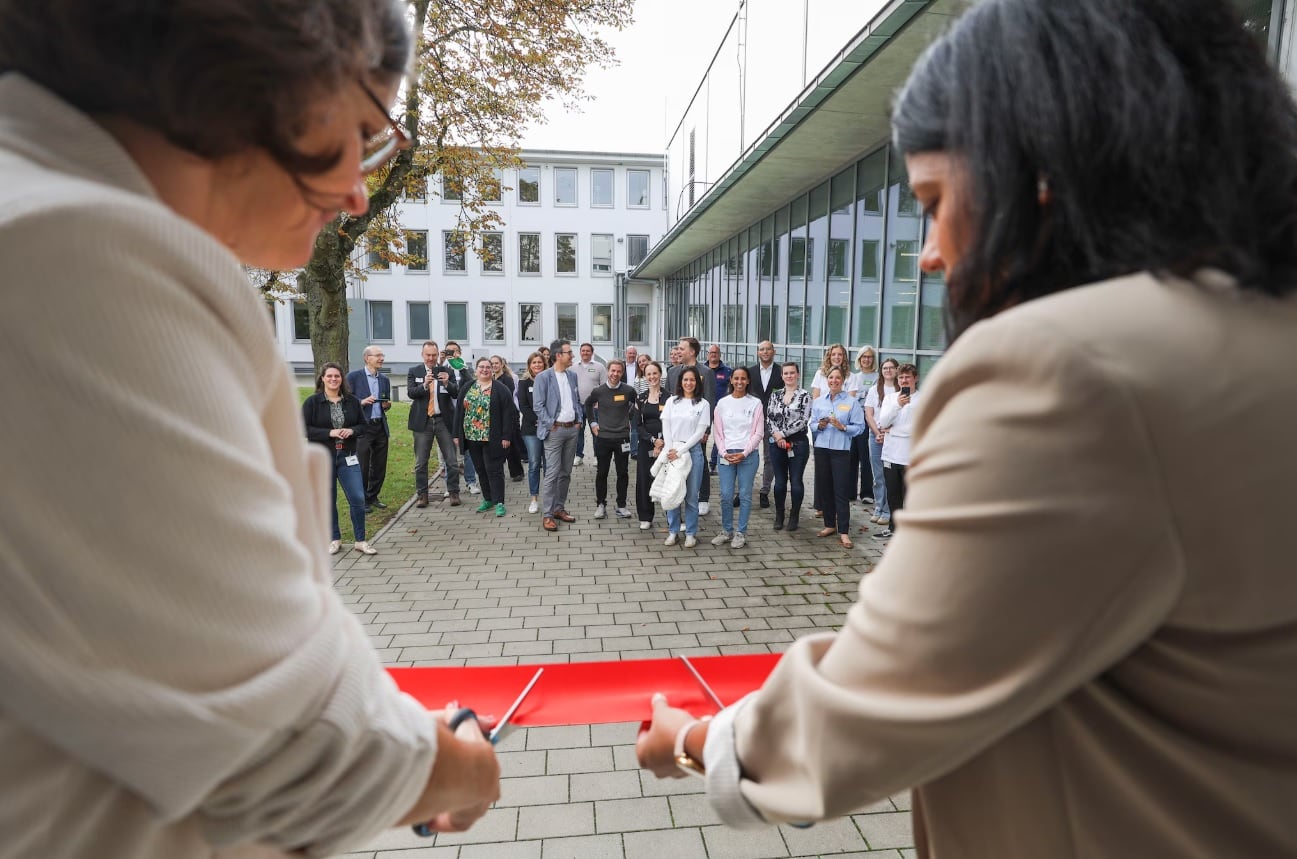 Bayer staff cut red ribbon at the new laboratory.