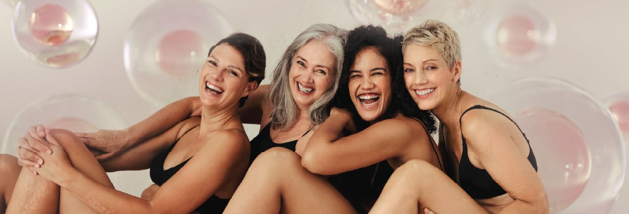 Healthy women sitting down and laughing