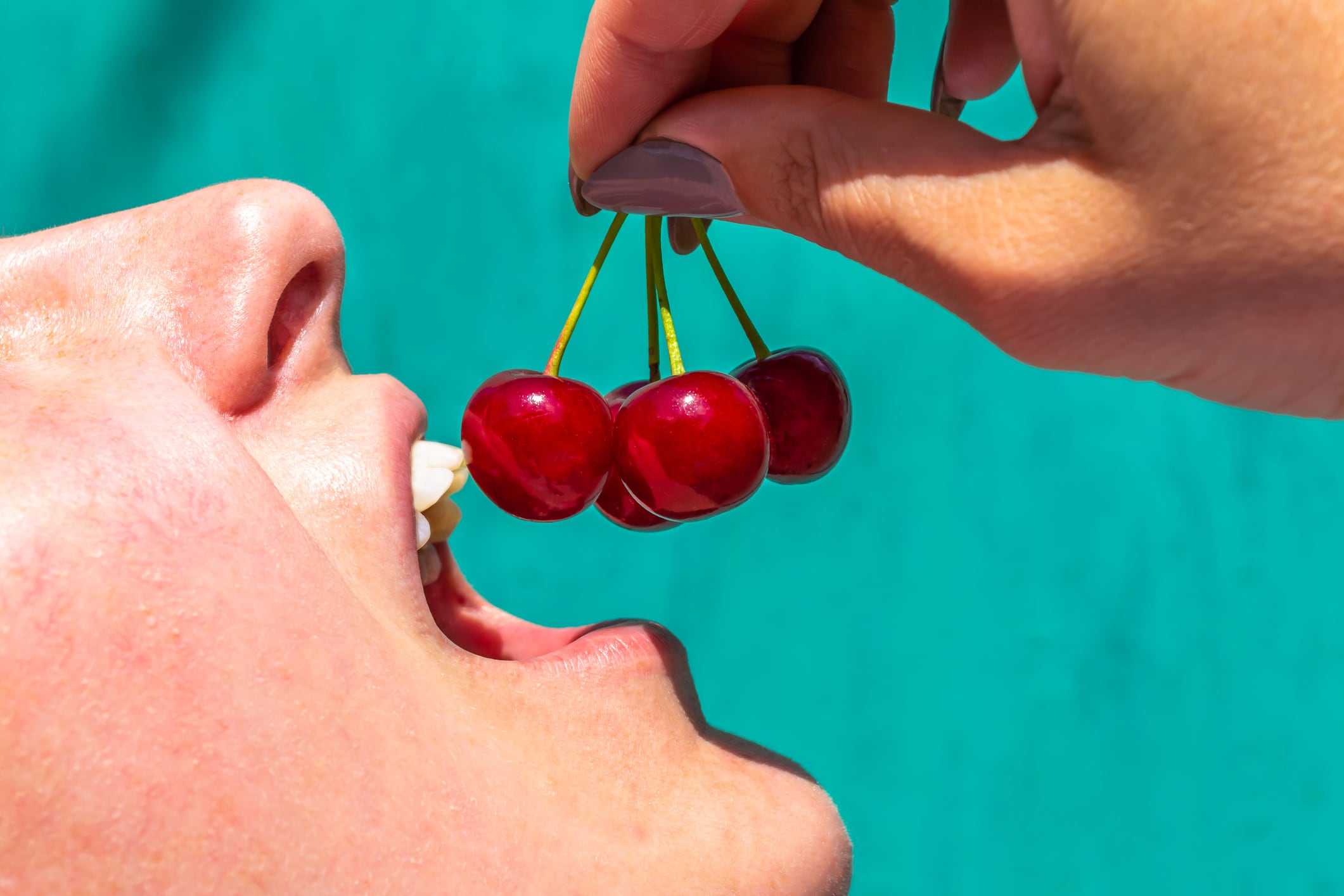 Woman eating cherries