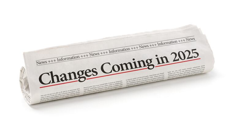 A rolled newspaper showing the headline Changes coming in 2025.