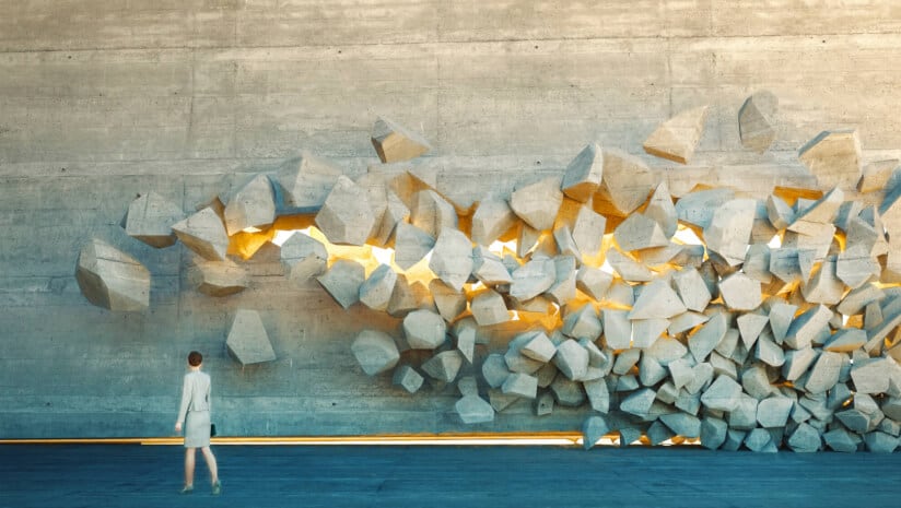 Image of a wall breaking down and light shining through