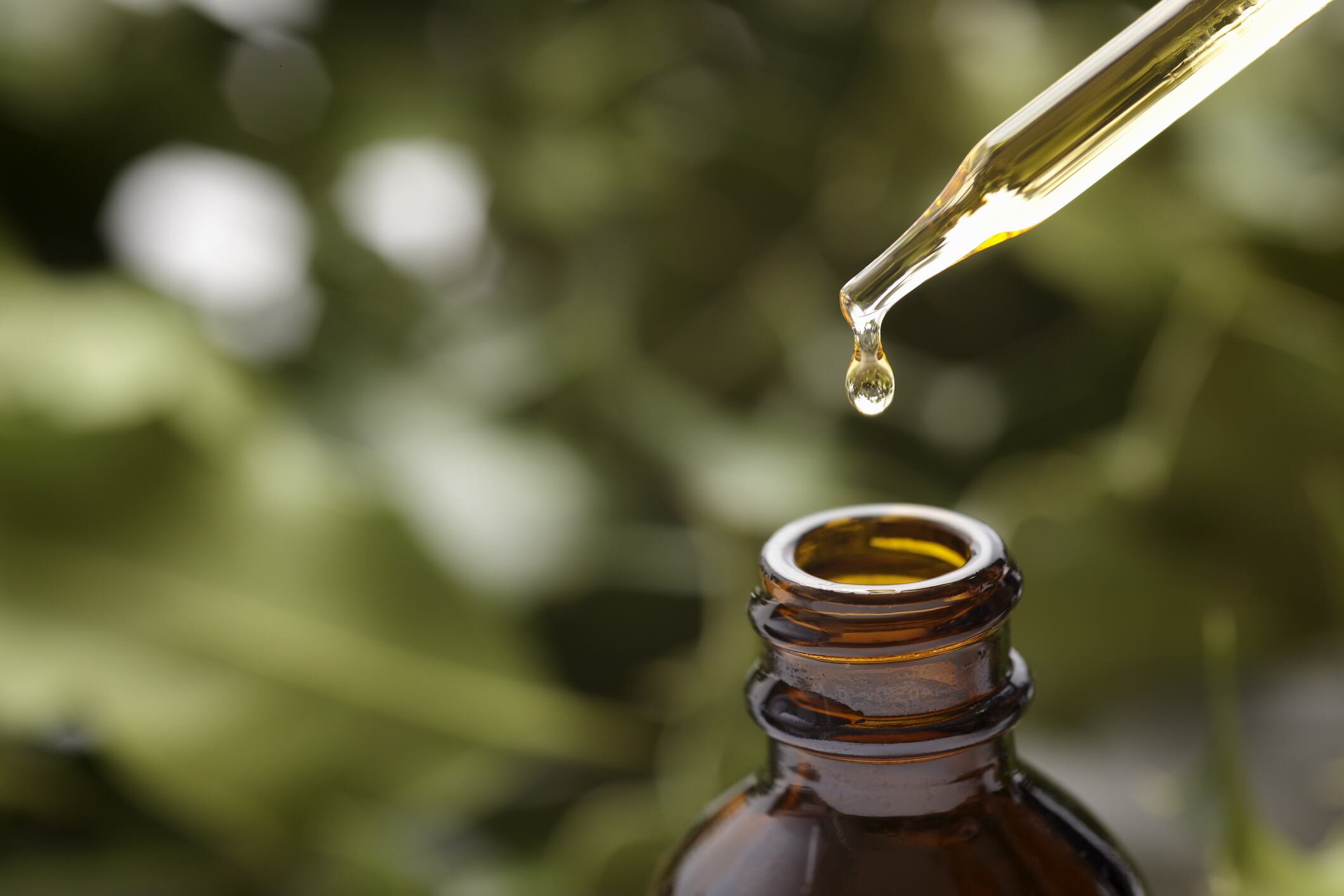 Brown herbal extraction bottle with a dropper.