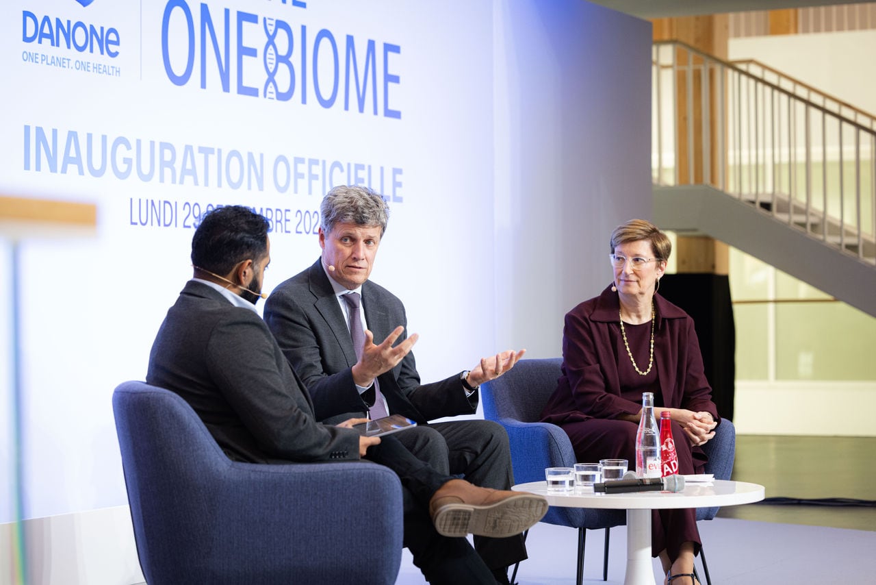 Danone CEO Antoine de Saint-Affrique speaking at inauguration of the OneBiome lab alongside chief research and innovation officer Isabelle Esser (right) and host Dr. Karan Rajan (left).