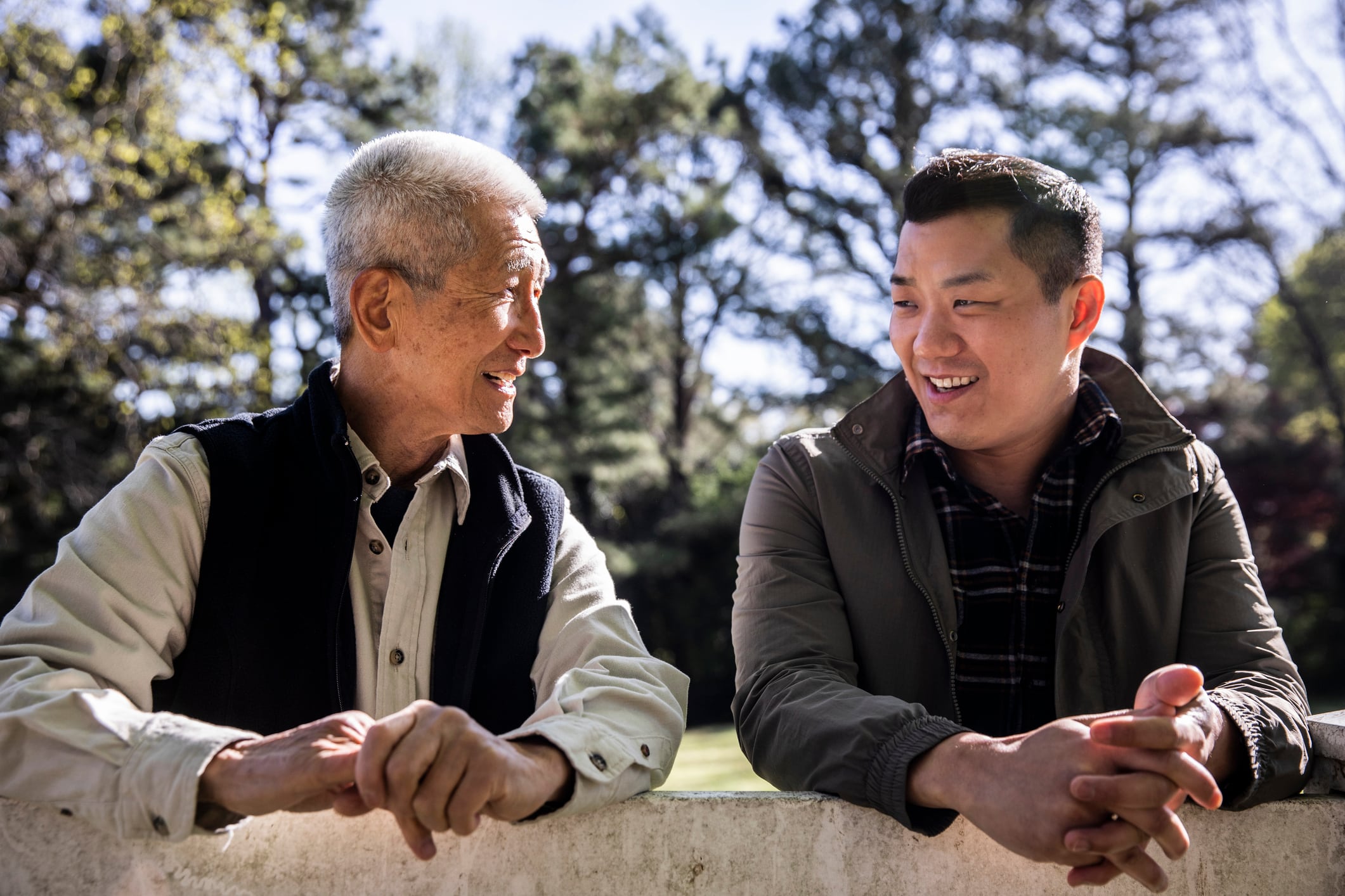 Senior Asian father and adult son