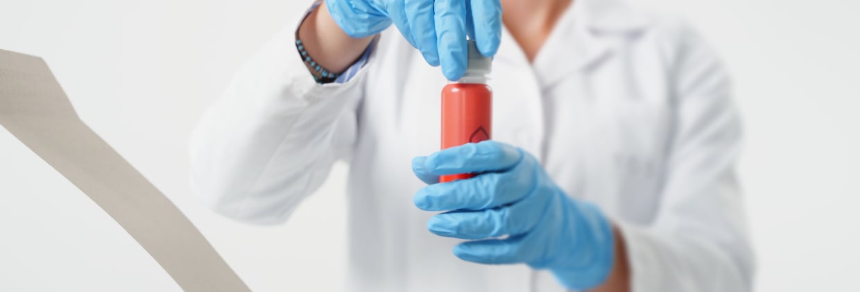 Person in lab holding liquid nutraceutical