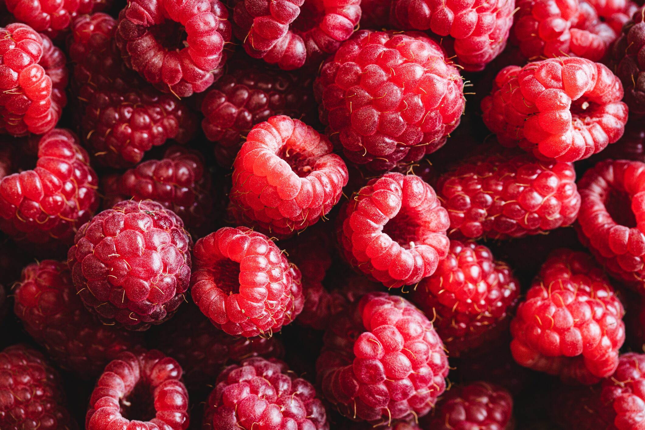Collection of fresh red raspberries.