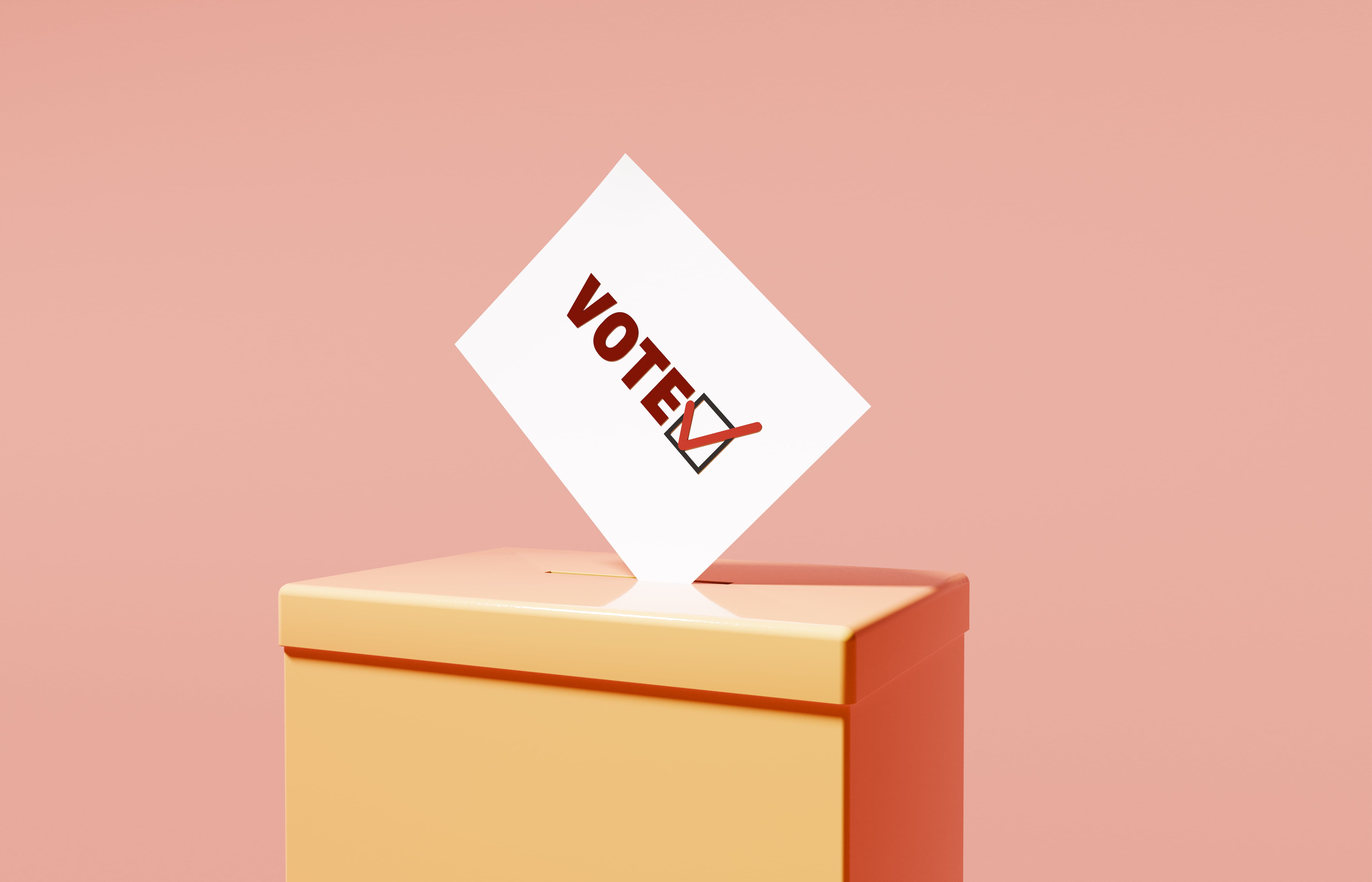 Studio image of a vote in a ballot box to illustrate concepts around election and voting
