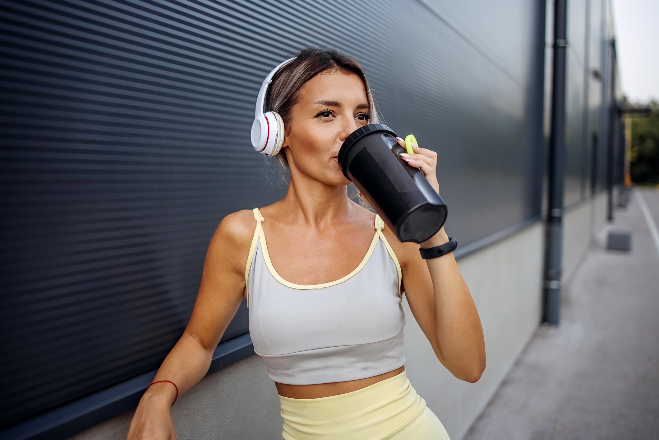 Woman drinking from sports bottle