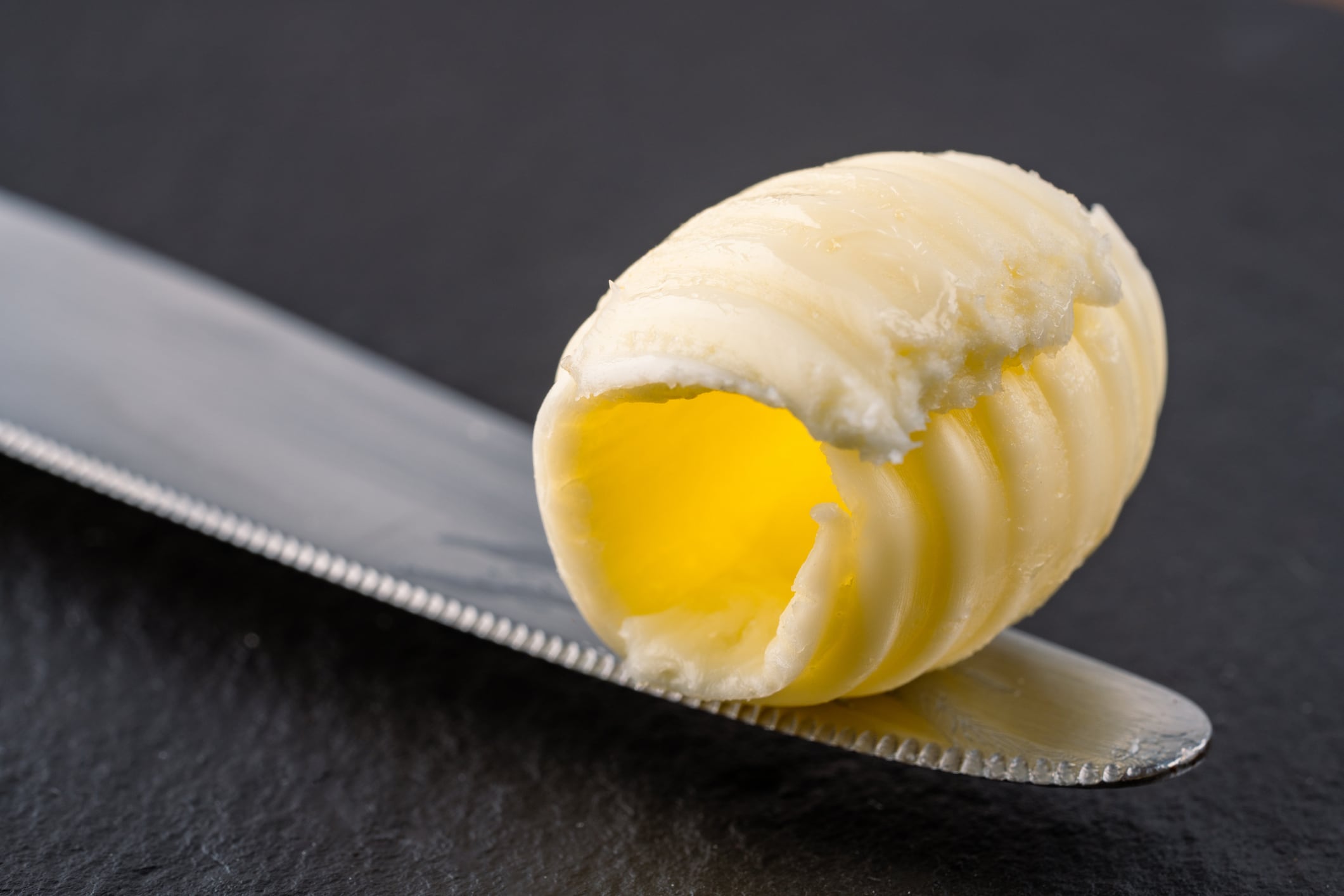 Butter that adds flavor to meals and is for breakfast on black background