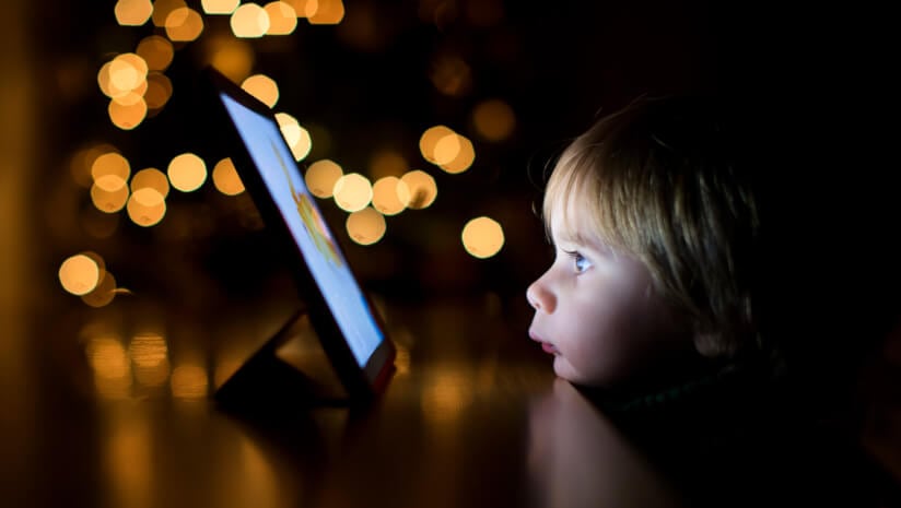 Child glued to an iPad screen