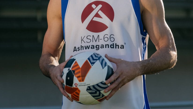 Robert Lewandowski holding soccer ball crop shot