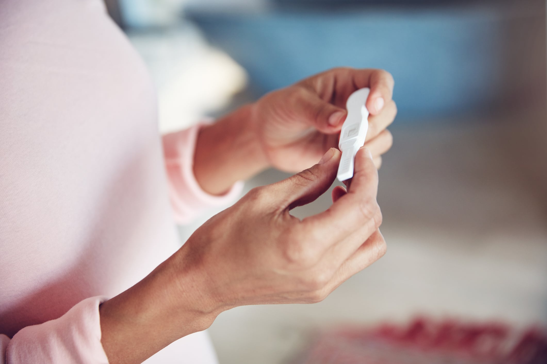 Cropped shot of a woman waiting for the results of a pregnancy test