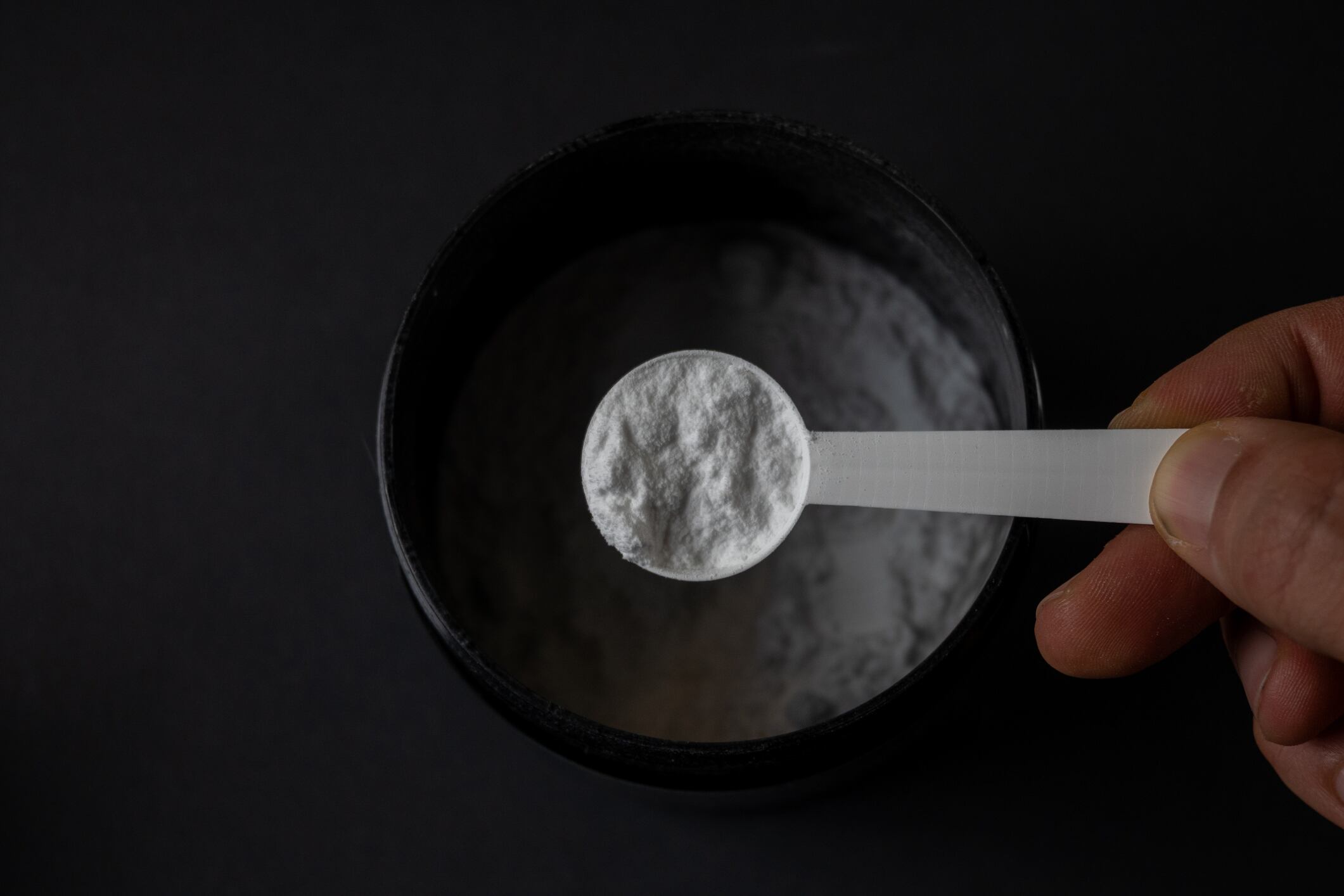Creatine container with scoop top view