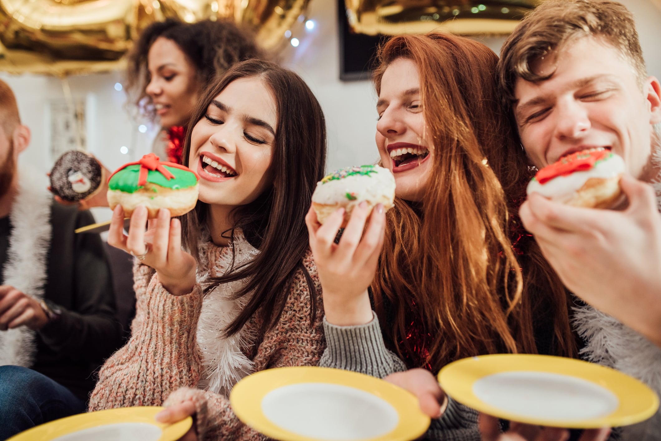 Happy friends eating cake