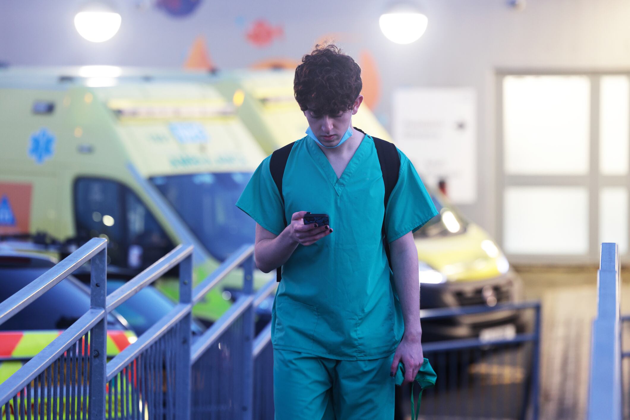 young junior doctor outside hospital after shift