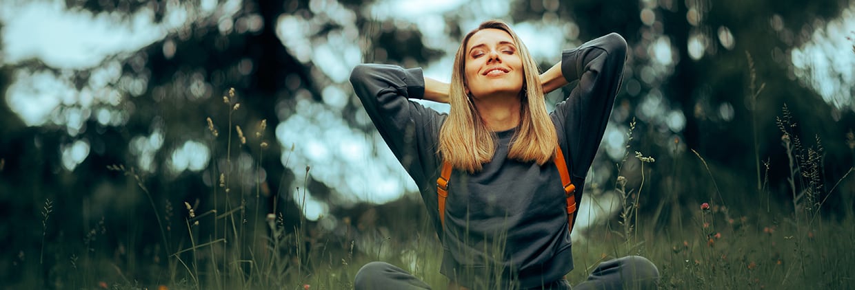 Healthy woman sat in field