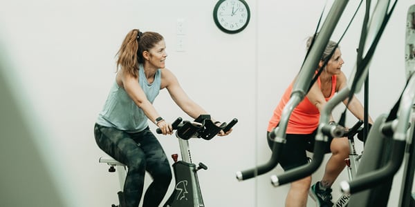 woman exercising on bike