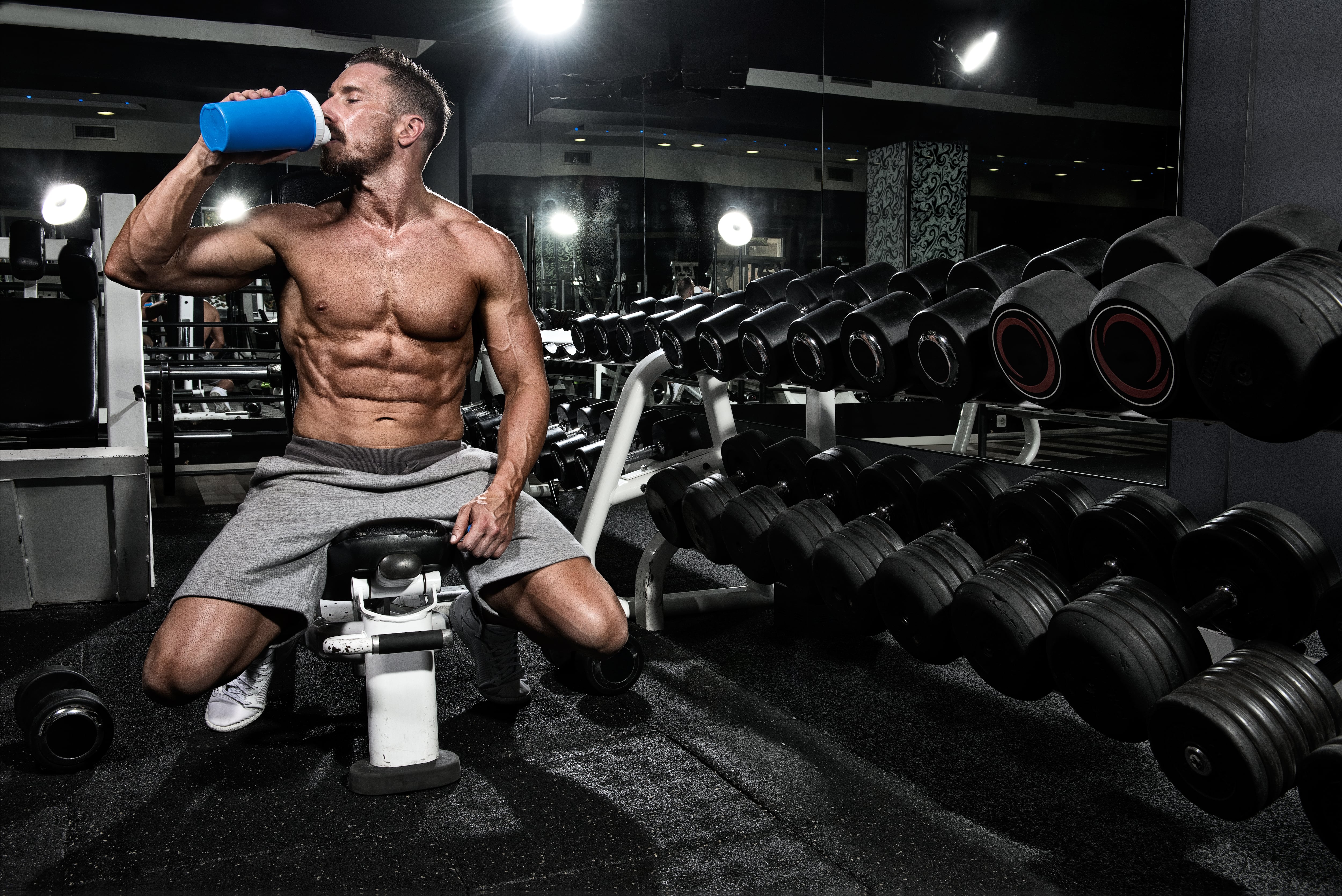 Man in gym drinking