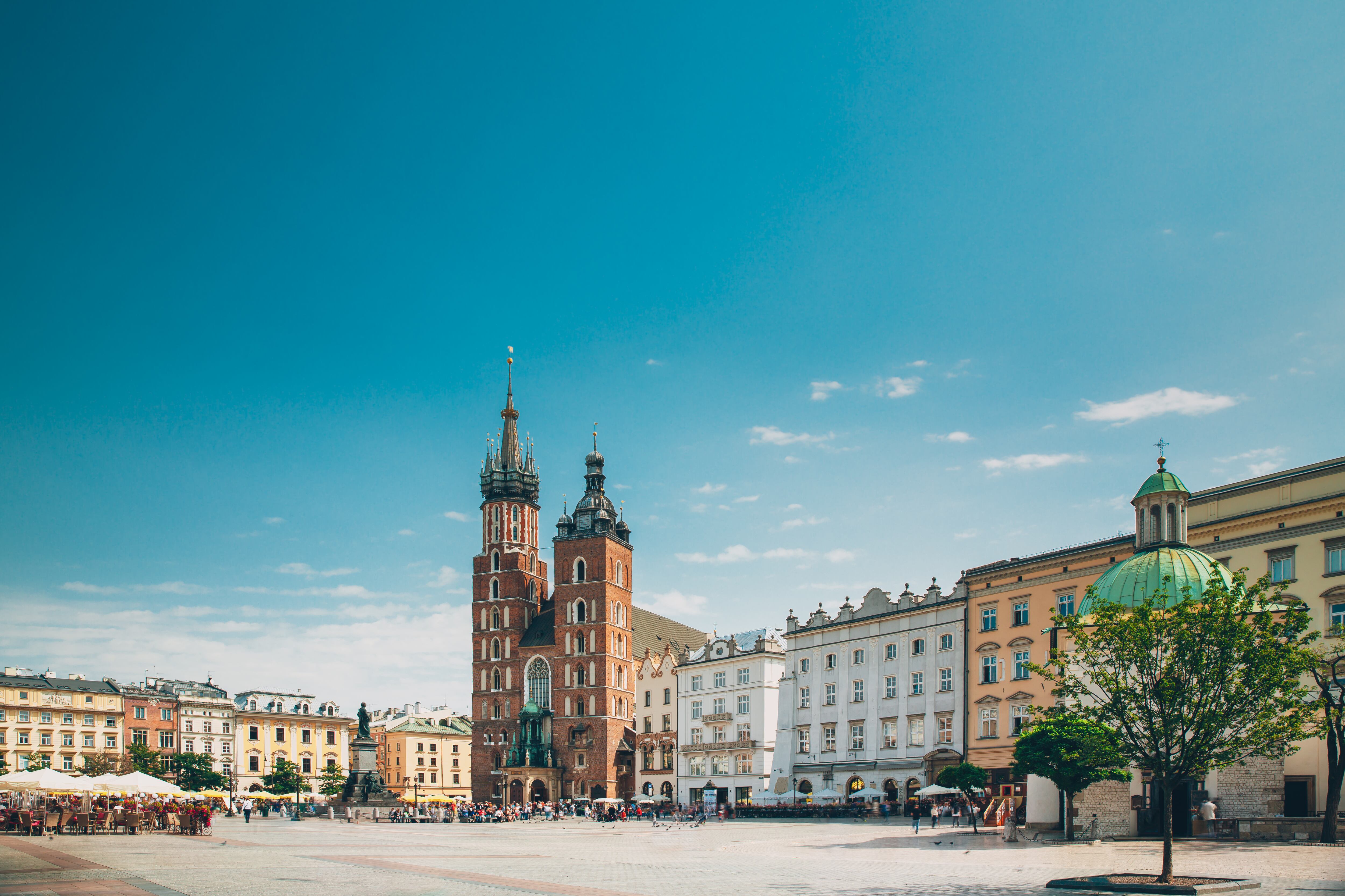 St. Mary's Basilica And Cloth Hall Building. Famous Old Landmark Church Of Our Lady Assumed Into Heaven. Saint Mary's Church In Of The Main Market Square. UNESCO World Heritage Site. Copy Space