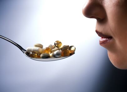 Taking-a-spoon-full-of-pills.jpg