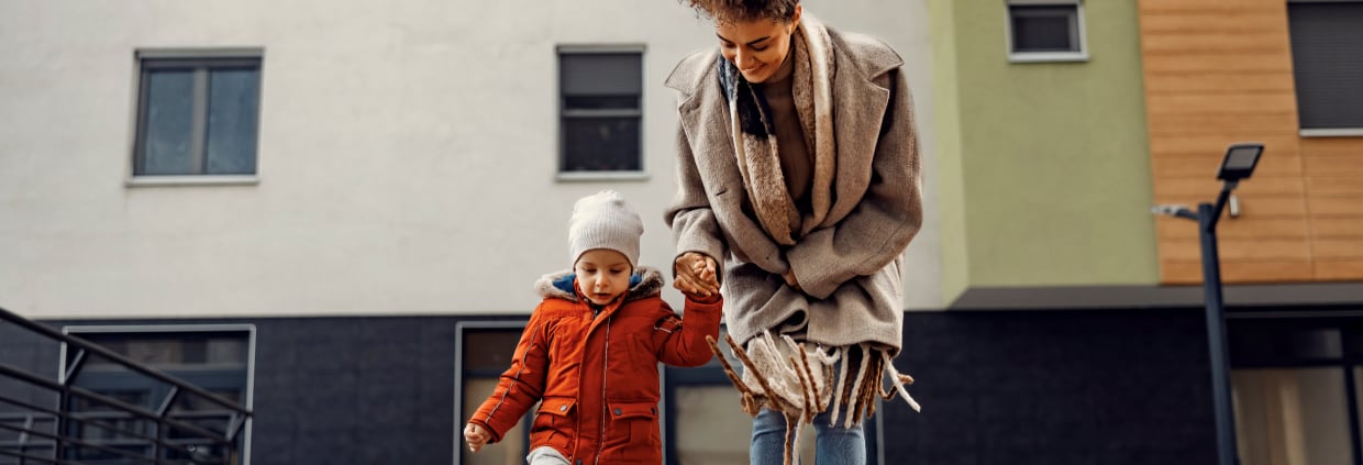 Mother and child walking down the street
