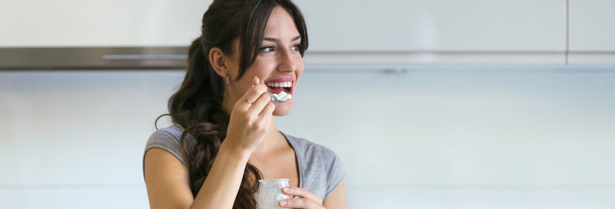 Woman eating yogurt