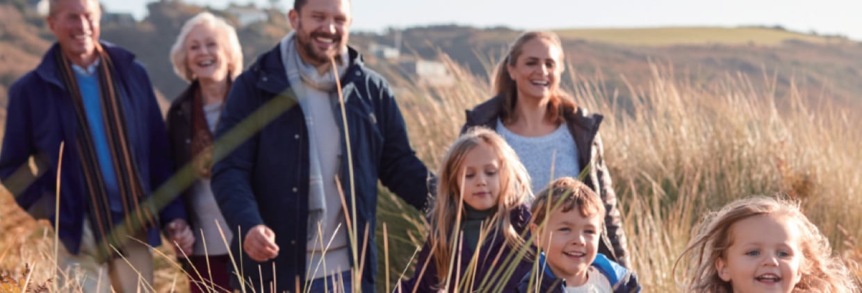 Family in field walking