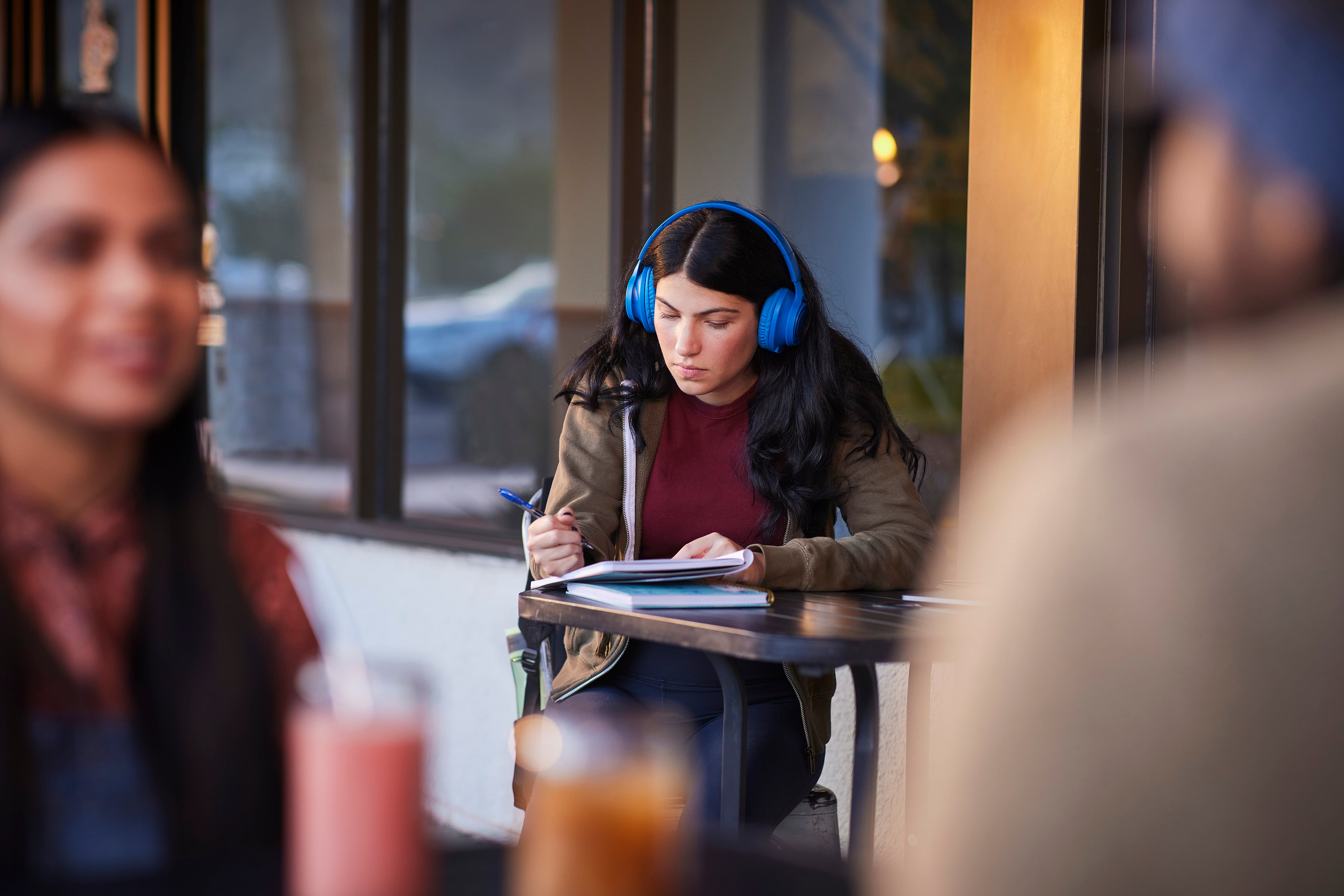 Woman with headphones working