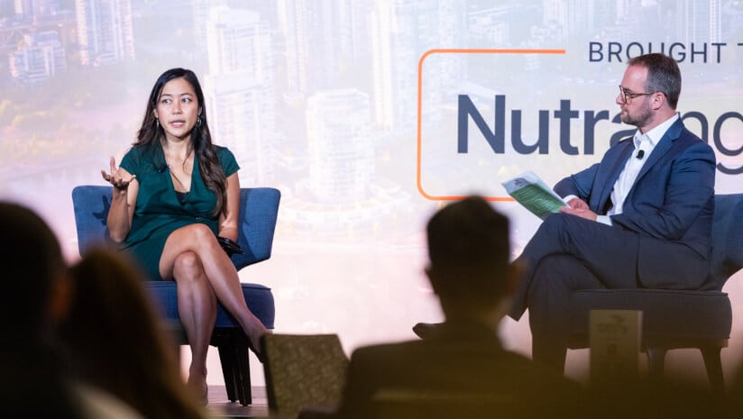 Cheryl Sew Hoy, founder and CEO of Tiny Health, on stage discussing her company's journey with Stephen Daniells, editor-in-chief of NutraIngredients, at Probiota Americas 2025 in Vancouver.