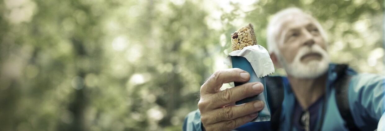 Man eating snack bar