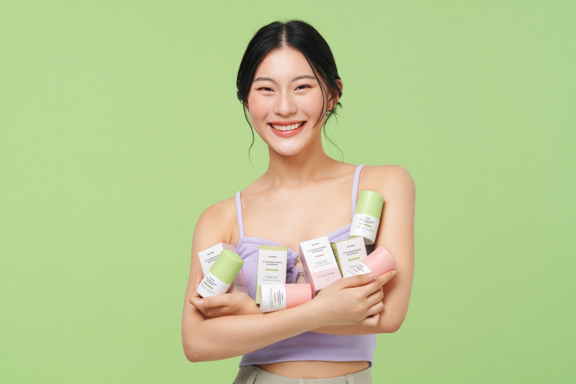 Blunies deodorants showcased in arms of model