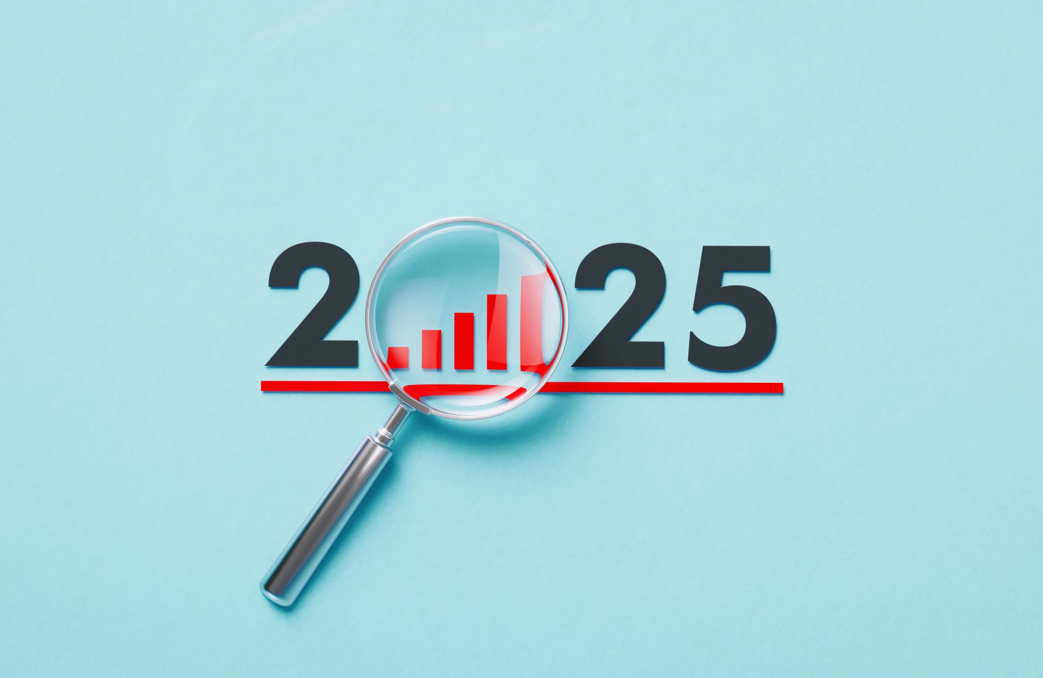 Magnifier forming 2025 on blue background. Horizontal composition with copy space.