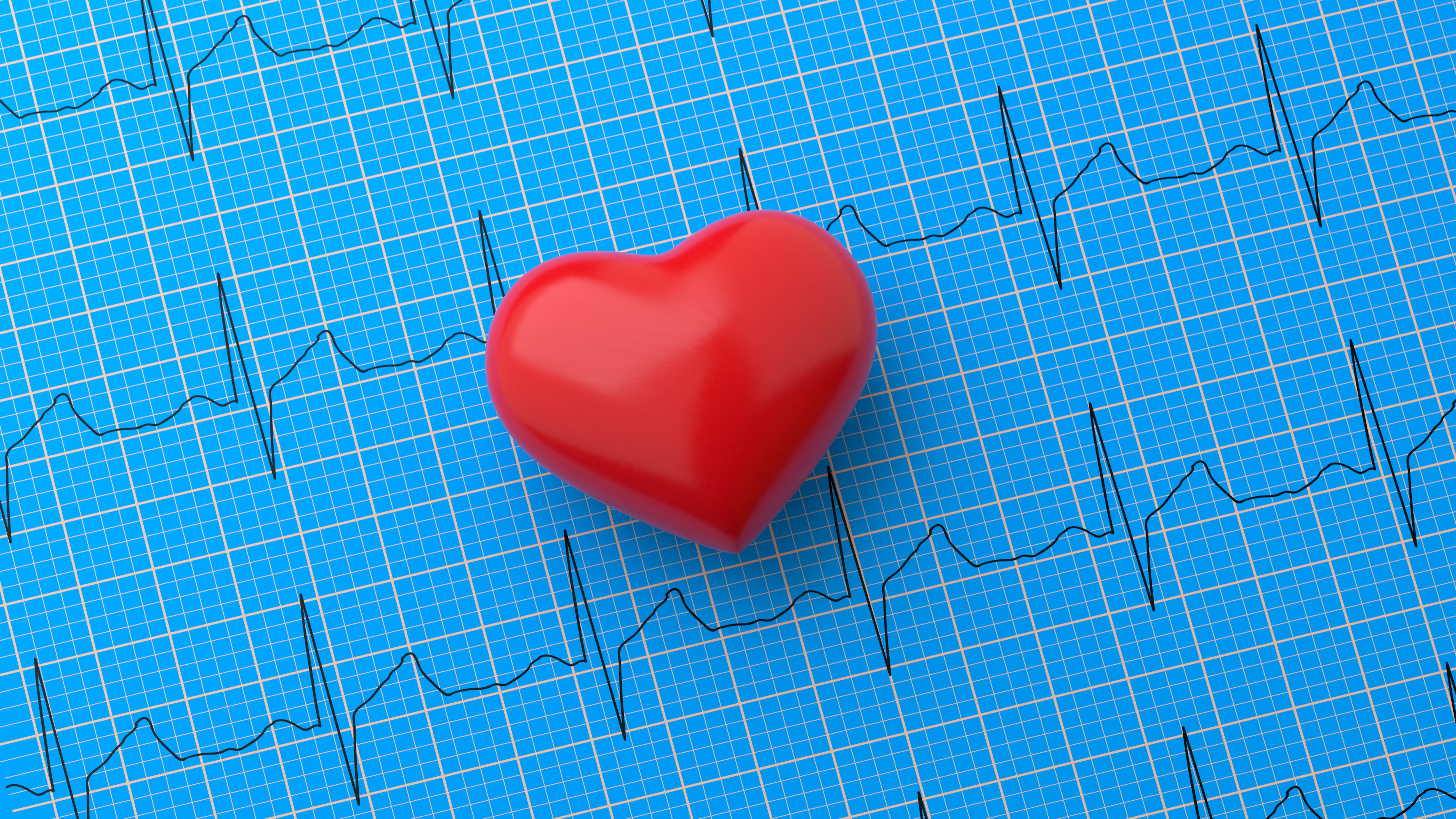 A clean and impactful 3D animation symbolizing heart health and medical diagnostics. A single, vibrant red heart shape rests on top of a blue electrocardiogram (EKG) printout, representing the rhythm and vitality of the cardiovascular system. This minimalist yet powerful image is a perfect metaphor for cardiology, health monitoring, and preventive care. It's an ideal visual for healthcare presentations, articles about leading a healthy lifestyle, and campaigns for World Heart Day, effectively communicating concepts of life, health, and wellbeing.