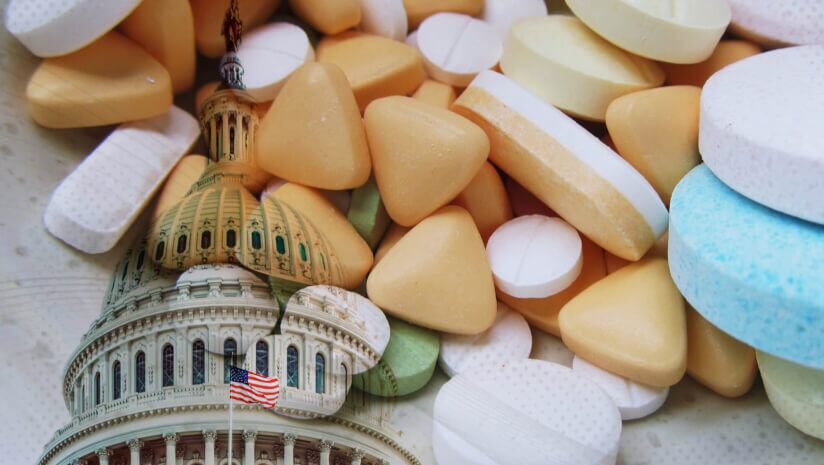 An image of tablets and pills superimposed on the U.S. capitol building