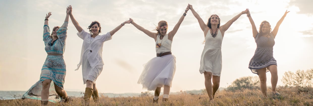 Five women running in field