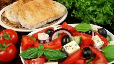 Switching to a Mediterranean-style diet could cut heart disease risk almost 50% according to a new study that followed more than 2,500 Greek adults for ten years.